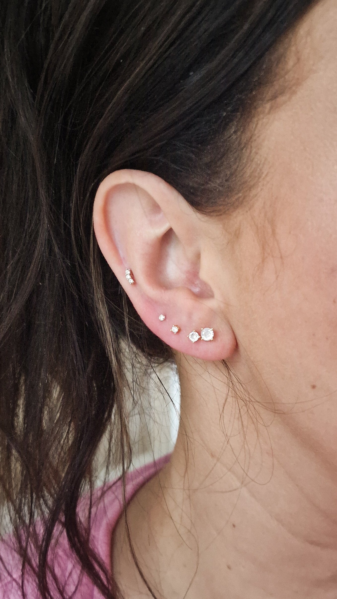 Wit steentje goud en zilver steker