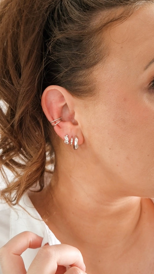 Not round oorbel ZILVER