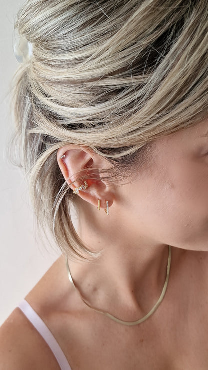 Growing white ear cuff